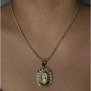 Brand new gold Virgin Mary necklace with colored stones.